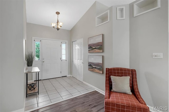 3001 Peach Blossom Ct, High Ridge, MO 63049 - entrance foyer with a chandelier, vaulted ceiling, and wood finished floors