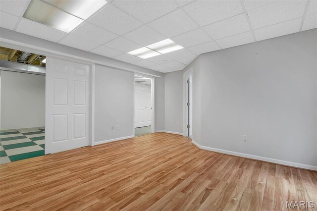3001 Peach Blossom Ct, High Ridge, MO 63049 - unfurnished bedroom featuring light wood-type flooring and a paneled ceiling