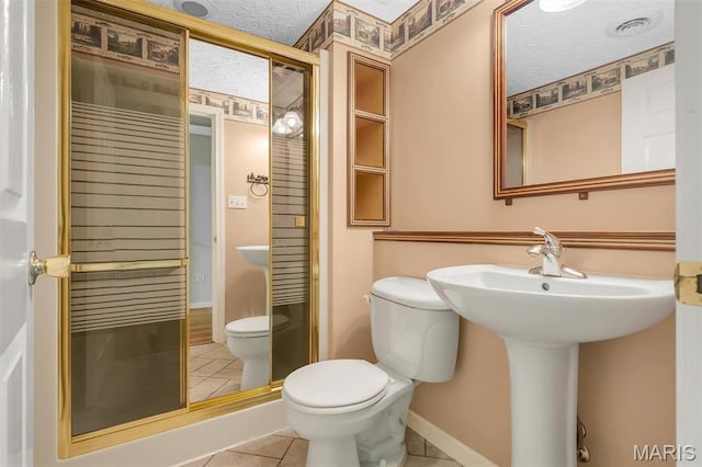 3001 Peach Blossom Ct, High Ridge, MO 63049 - bathroom with tile patterned flooring, a textured ceiling, and a shower stall