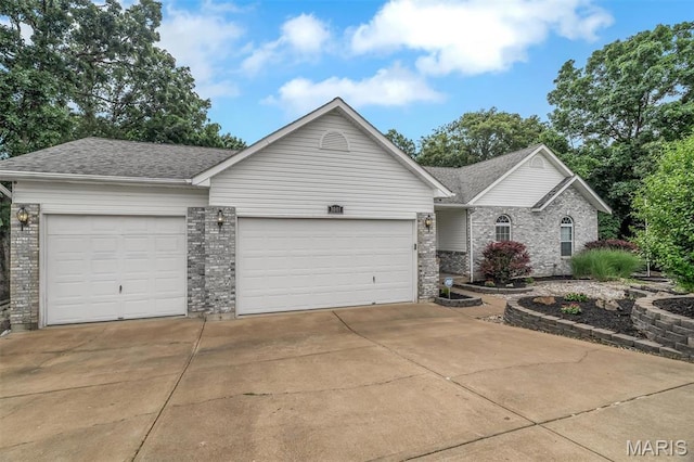 3001 Peach Blossom Ct, High Ridge, MO 63049 - view of front facade featuring an attached garage, brick siding, driveway, and roof with shingles