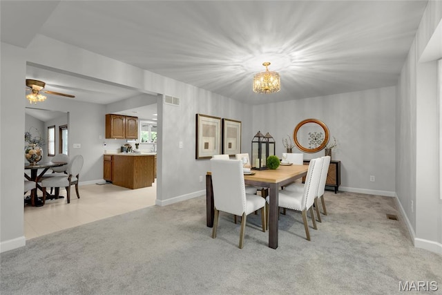 2280 Ebert Ln, Wentzville, MO 63385 - dining space with a chandelier, light colored carpet, and ceiling fan