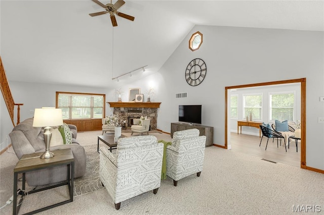 2280 Ebert Ln, Wentzville, MO 63385 - living room with a ceiling fan, carpet flooring, high vaulted ceiling, rail lighting, and a fireplace