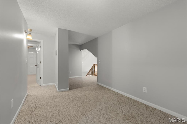 2280 Ebert Ln, Wentzville, MO 63385 - spare room featuring carpet and a textured ceiling