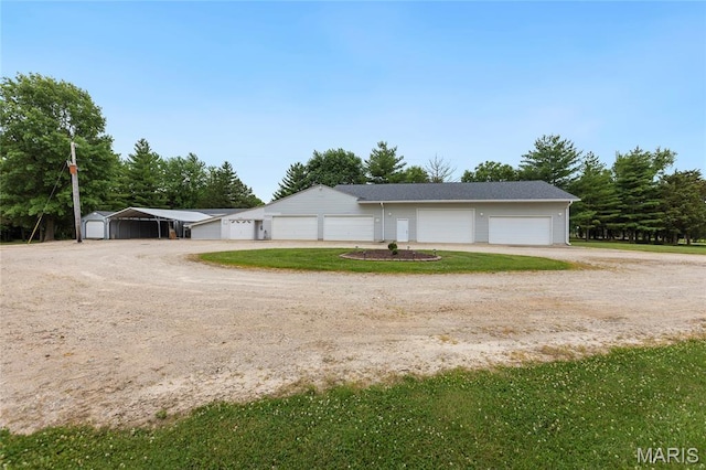 2280 Ebert Ln, Wentzville, MO 63385 - view of front of house with driveway, an outdoor structure, and a detached garage
