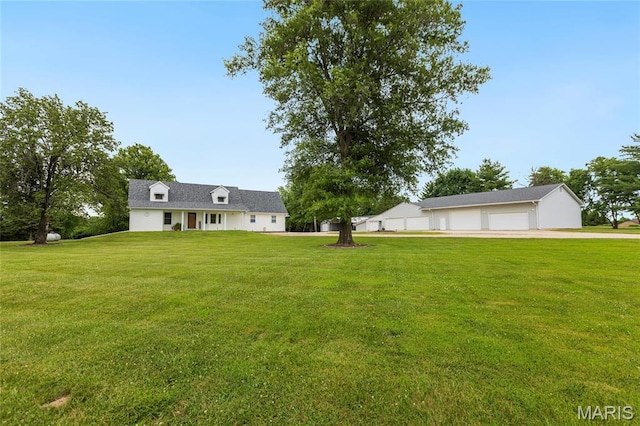2280 Ebert Ln, Wentzville, MO 63385 - view of green lawn with a detached garage