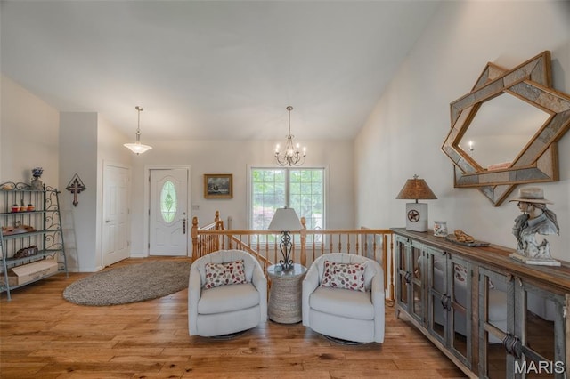 11400 Macs Cove Dr, Wright City, MO 63390 - sitting room with wood finished floors, a chandelier, and lofted ceiling
