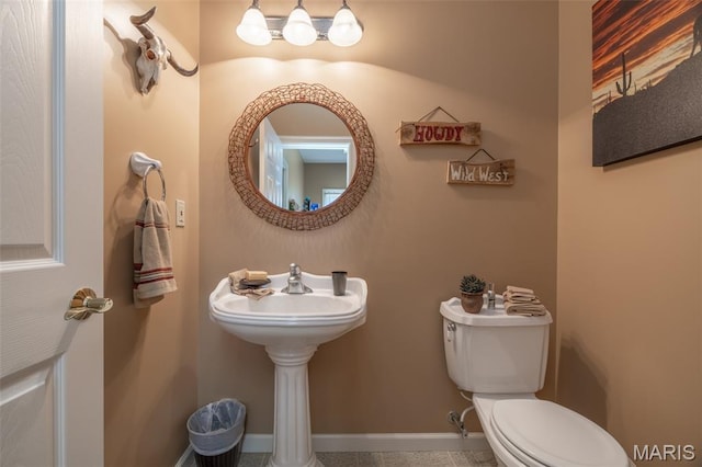 11400 Macs Cove Dr, Wright City, MO 63390 - bathroom featuring toilet, baseboards, and tile patterned floors