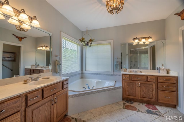 11400 Macs Cove Dr, Wright City, MO 63390 - bathroom featuring a shower stall, two vanities, tile patterned flooring, and a bath