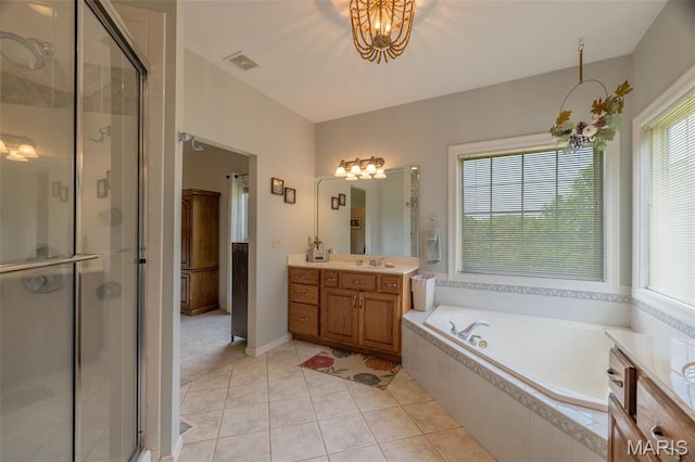 11400 Macs Cove Dr, Wright City, MO 63390 - bathroom with vanity, a garden tub, a stall shower, tile patterned floors, and a chandelier