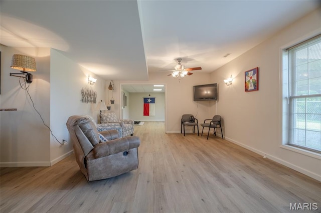 11400 Macs Cove Dr, Wright City, MO 63390 - living room with wood finished floors, baseboards, and ceiling fan