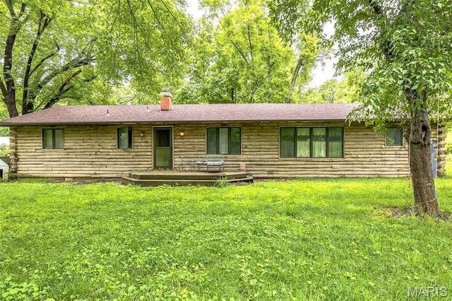 10049 Chateau Rd, Sullivan, MO 63080 - view of front of home with log exterior, a chimney, and a front yard