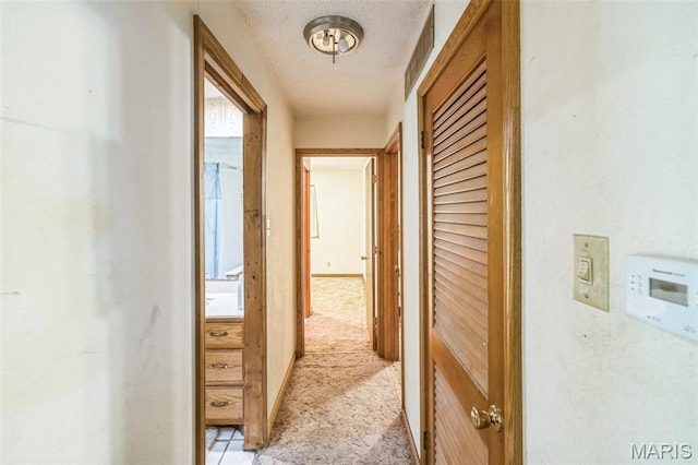 10049 Chateau Rd, Sullivan, MO 63080 - hallway featuring light colored carpet and a textured ceiling