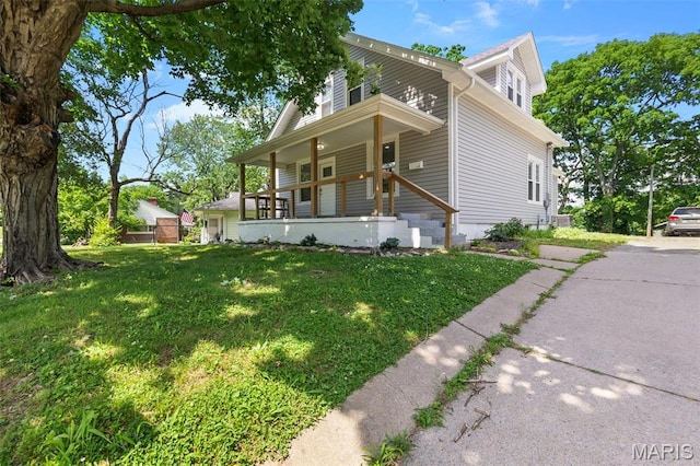 1210 Perryville Rd, Cape Girardeau, MO 63701 - view of front facade featuring covered porch and a front yard
