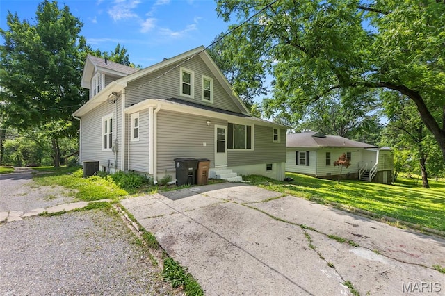 1210 Perryville Rd, Cape Girardeau, MO 63701 - view of front of property with entry steps, central air condition unit, and a front yard