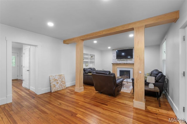 1210 Perryville Rd, Cape Girardeau, MO 63701 - living area with light wood finished floors, a large fireplace, baseboards, and recessed lighting