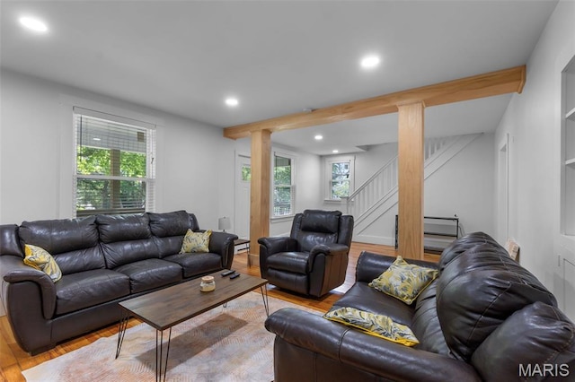 1210 Perryville Rd, Cape Girardeau, MO 63701 - living room featuring wood finished floors, stairway, recessed lighting, and decorative columns