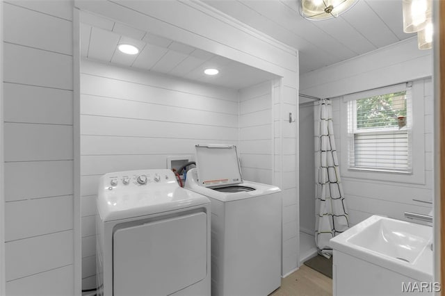1210 Perryville Rd, Cape Girardeau, MO 63701 - washroom featuring washer and dryer, light wood finished floors, recessed lighting, crown molding, and wooden walls