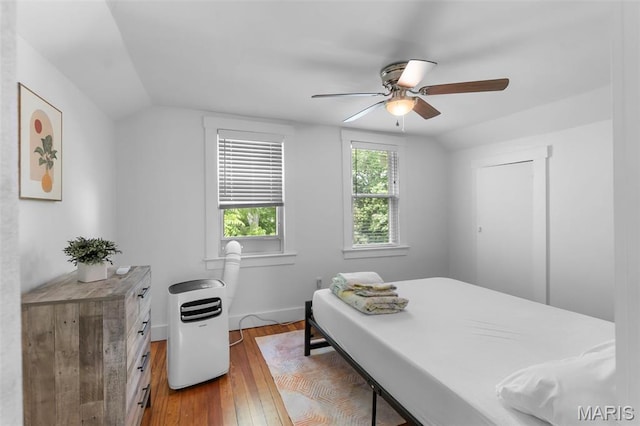 1210 Perryville Rd, Cape Girardeau, MO 63701 - bedroom featuring hardwood / wood-style flooring, vaulted ceiling, baseboards, and a ceiling fan