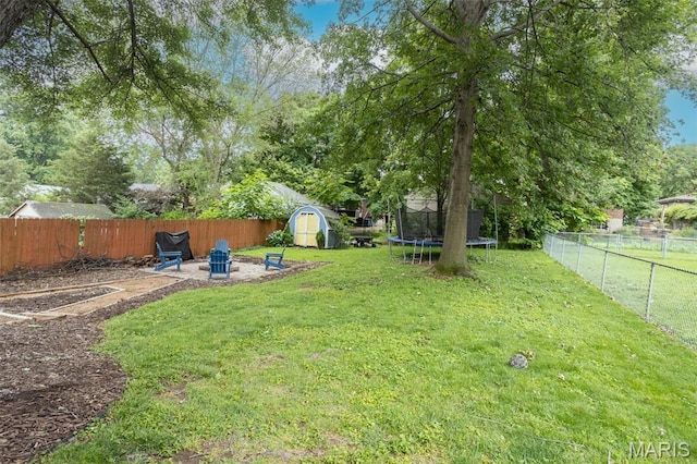 7330 Lansdowne Ave, Saint Louis, MO 63119 - view of yard featuring a trampoline and a patio