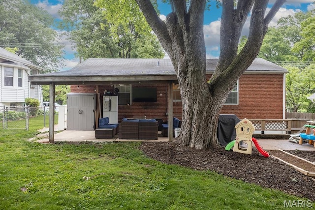 7330 Lansdowne Ave, Saint Louis, MO 63119 - rear view of house featuring a patio area, an outdoor hangout area, brick siding, and roof with shingles