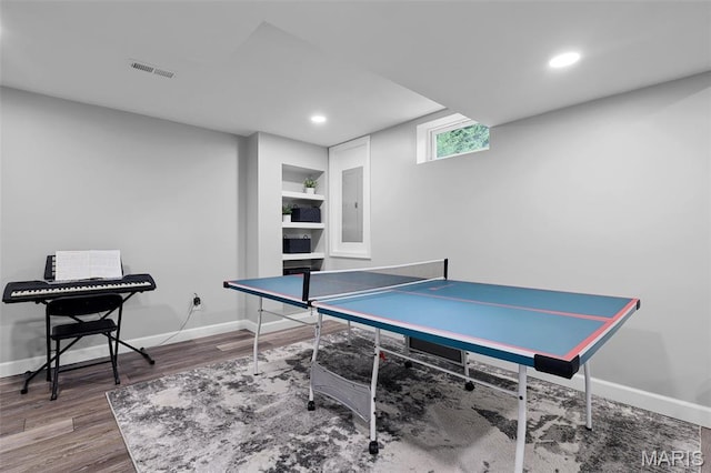 426 Highland Peak Ct, Ofallon, IL 62269 - recreation room featuring electric panel, wood finished floors, baseboards, and recessed lighting