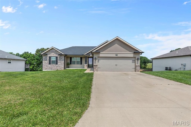 192 Fraser Rdg, Jackson, MO 63755 - view of front of home featuring brick siding, a garage, concrete driveway, and a front yard