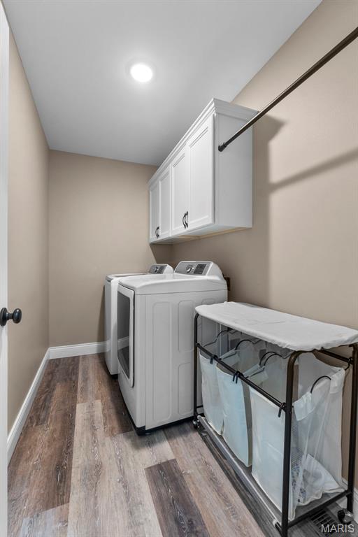 192 Fraser Rdg, Jackson, MO 63755 - washroom with washing machine and clothes dryer, light wood-type flooring, cabinet space, baseboards, and recessed lighting