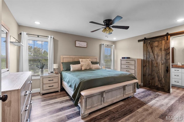 192 Fraser Rdg, Jackson, MO 63755 - bedroom featuring a barn door, wood finished floors, recessed lighting, baseboards, and ceiling fan