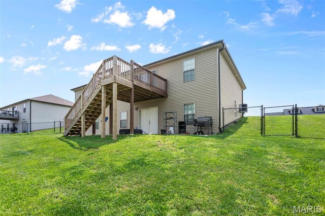 192 Fraser Rdg, Jackson, MO 63755 - back of property with a gate, stairway, and a wooden deck