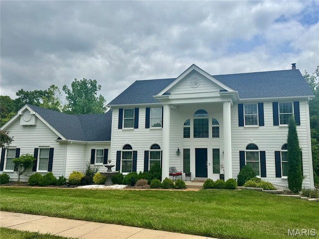 1525 Honey Locust Ct, Wildwood, MO 63005 - neoclassical / greek revival house featuring a front yard and a shingled roof