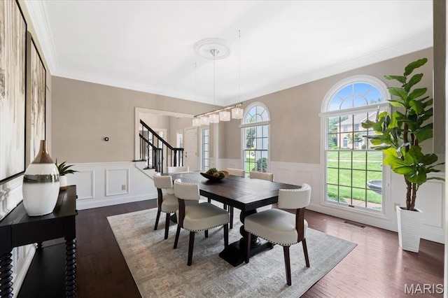 1525 Honey Locust Ct, Wildwood, MO 63005 - dining room featuring stairs, a wainscoted wall, ornamental molding, dark wood finished floors, and a decorative wall