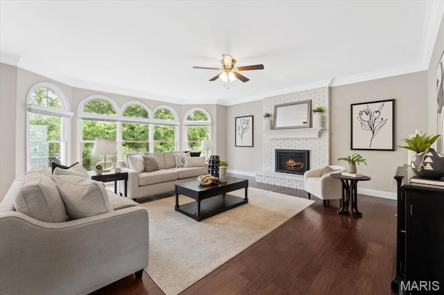 1525 Honey Locust Ct, Wildwood, MO 63005 - living area with ceiling fan, dark wood-type flooring, a fireplace, ornamental molding, and healthy amount of natural light