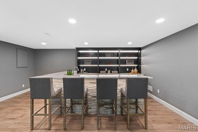 1525 Honey Locust Ct, Wildwood, MO 63005 - indoor wet bar featuring recessed lighting and light wood-style floors