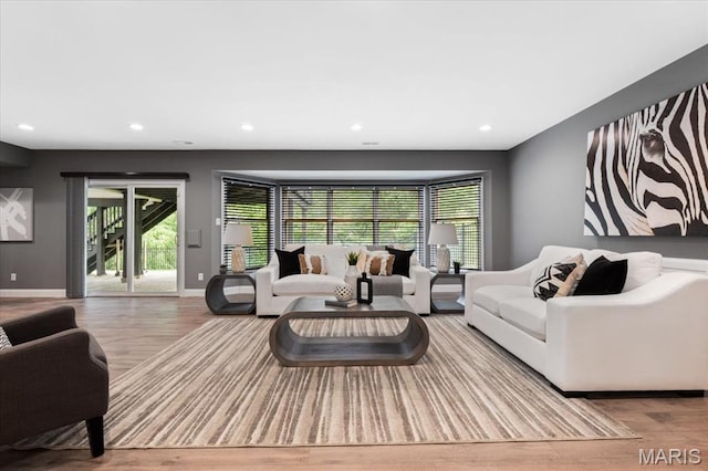 1525 Honey Locust Ct, Wildwood, MO 63005 - living area featuring wood finished floors, recessed lighting, and healthy amount of natural light