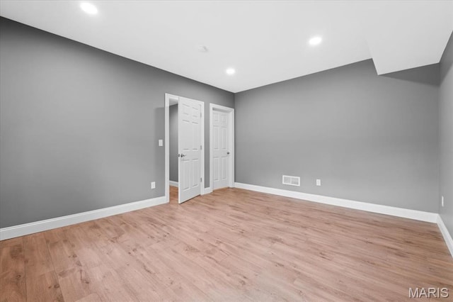 1525 Honey Locust Ct, Wildwood, MO 63005 - unfurnished bedroom with light wood-type flooring and recessed lighting