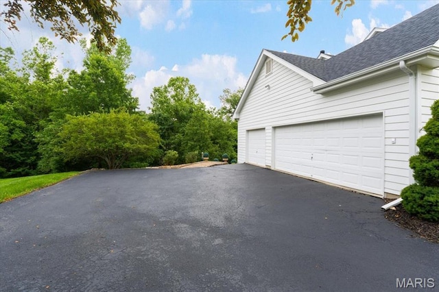 1525 Honey Locust Ct, Wildwood, MO 63005 - garage featuring asphalt driveway