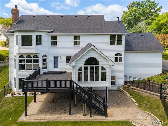 1525 Honey Locust Ct, Wildwood, MO 63005 - rear view of house with a wooden deck, a shingled roof, stairway, a fenced backyard, and a chimney