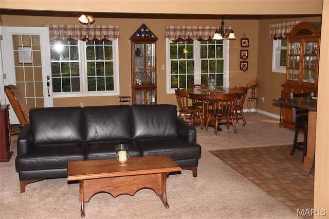 8404 E Twin Oaks Dr, Effingham, IL 62401 - living room featuring carpet flooring, a chandelier, and baseboards