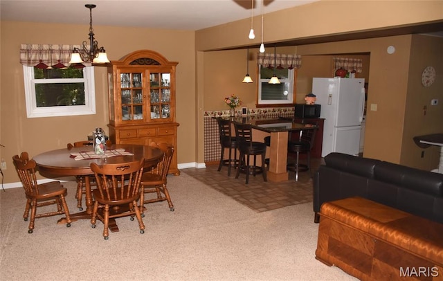8404 E Twin Oaks Dr, Effingham, IL 62401 - dining space with baseboards and a chandelier