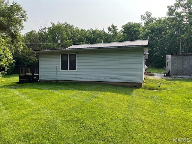 11142 E State Highway 47, Cadet, MO 63630 - view of home's exterior with a lawn, a deck, and metal roof