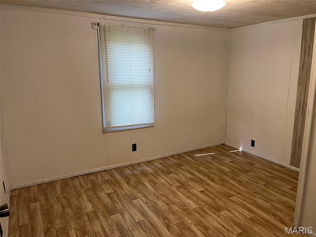 11142 E State Highway 47, Cadet, MO 63630 - empty room featuring wood finished floors, a textured ceiling, and baseboards