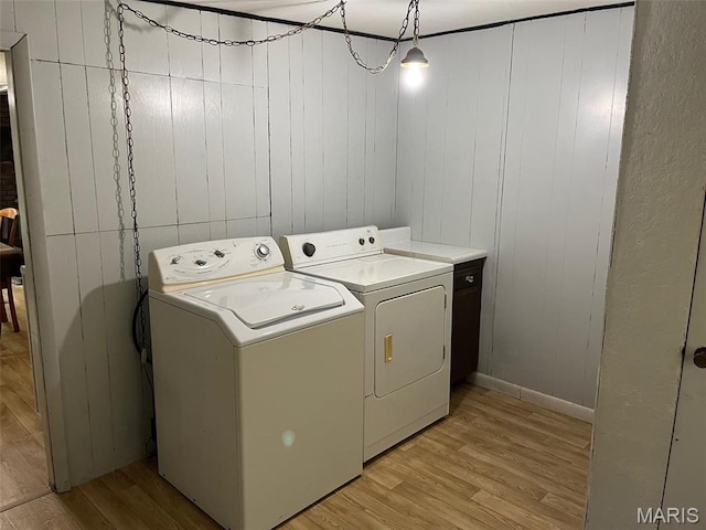11142 E State Highway 47, Cadet, MO 63630 - laundry room featuring washing machine and dryer, light wood finished floors, and baseboards