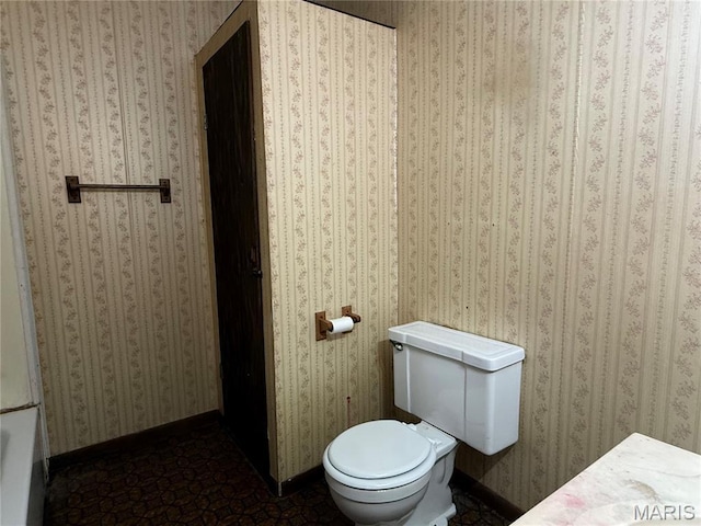 417 N Section St, Hannibal, MO 63401 - bathroom with toilet and baseboards