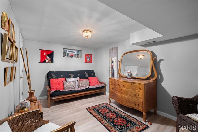 2604 Jonathan Dr, Mehlville, MO 63125 - living area featuring wood finished floors and baseboards
