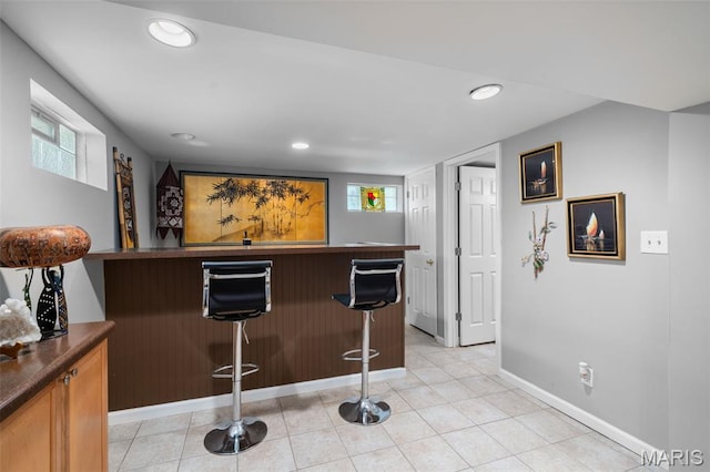 2604 Jonathan Dr, Mehlville, MO 63125 - indoor bar with recessed lighting and light tile patterned floors