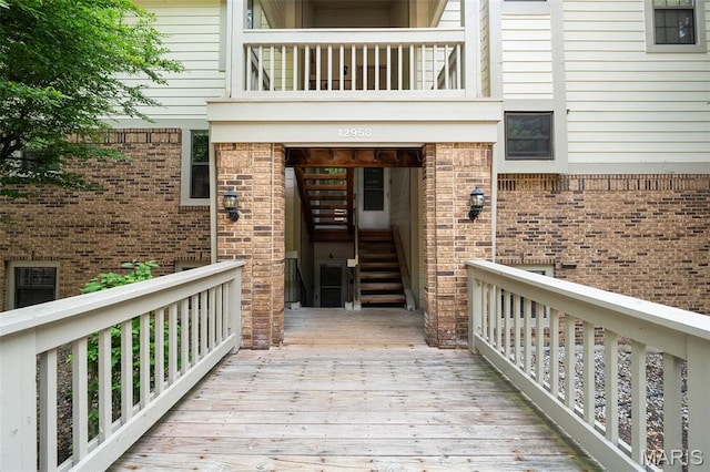 12958 Bryce Canyon Dr Unit C, Maryland Heights, MO 63043 - view of exterior entry featuring brick siding and a deck