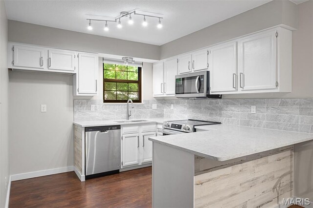 12958 Bryce Canyon Dr Unit C, Maryland Heights, MO 63043 - kitchen featuring stainless steel appliances, a peninsula, white cabinetry, a sink, and light countertops