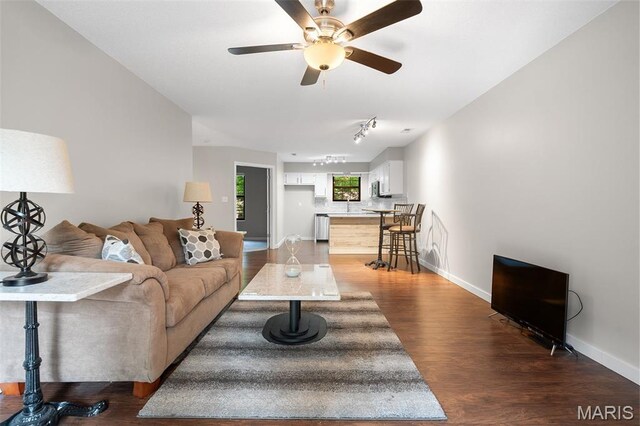 12958 Bryce Canyon Dr Unit C, Maryland Heights, MO 63043 - living area featuring wood finished floors, baseboards, ceiling fan, and rail lighting