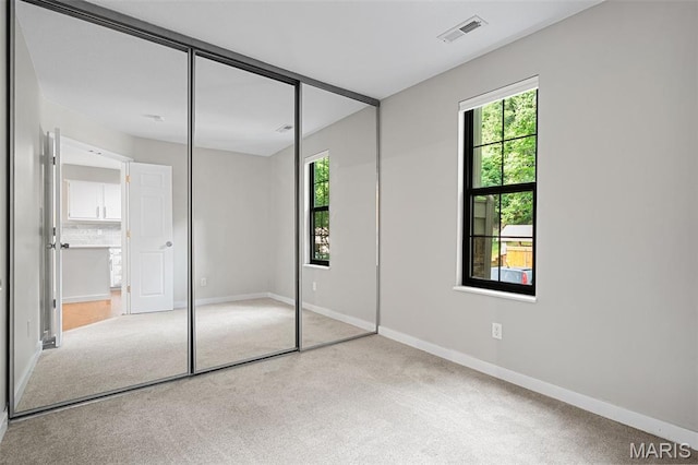 12958 Bryce Canyon Dr Unit C, Maryland Heights, MO 63043 - unfurnished bedroom with carpet flooring, baseboards, and a closet
