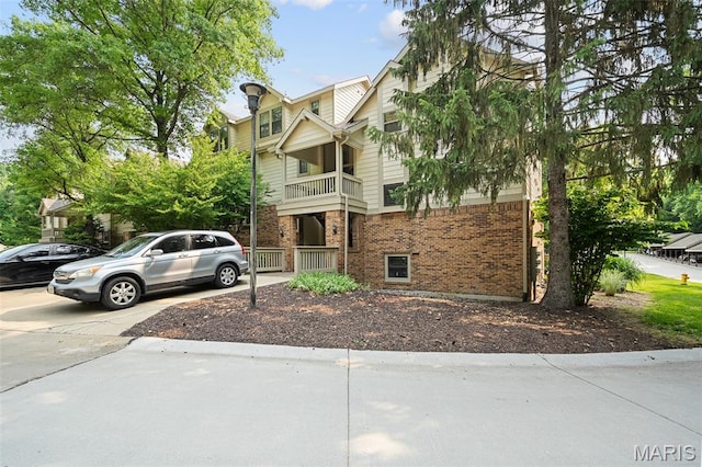 12958 Bryce Canyon Dr Unit C, Maryland Heights, MO 63043 - view of front of house featuring a balcony and brick siding